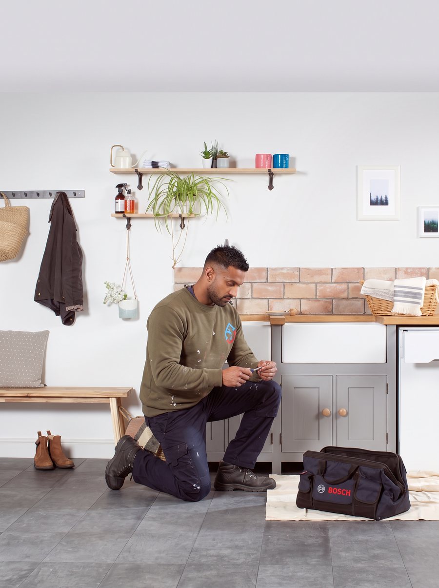 Synergy Gas & Plumbing engineer preparing for a job