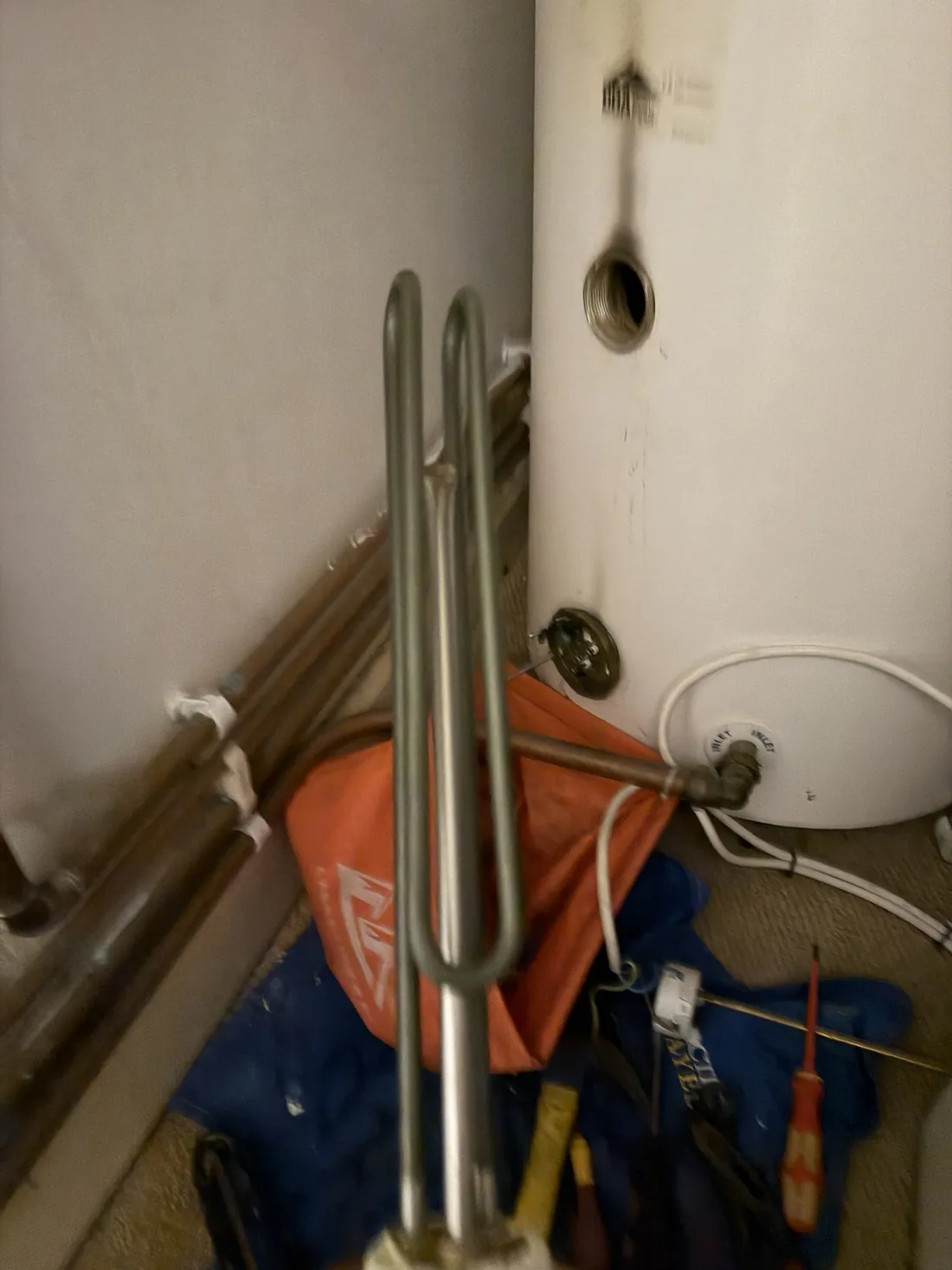 New stainless immersion heater element ready to fit into a Megaflo unvented cylinder