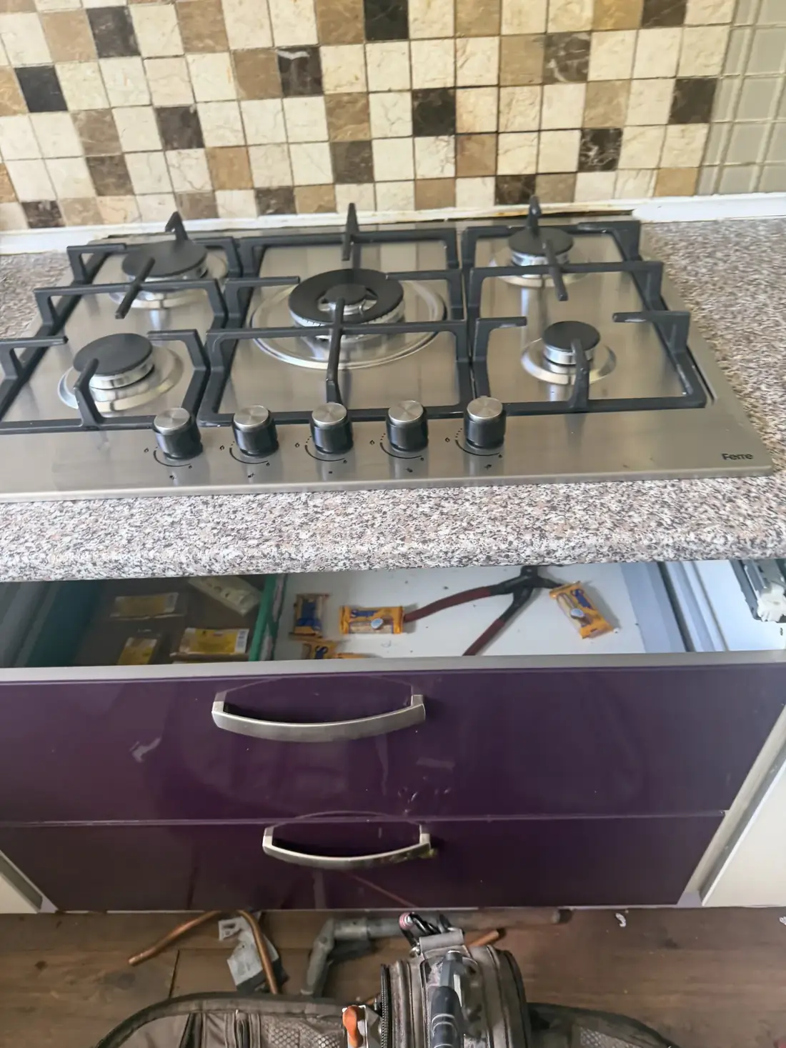 New five-burner stainless-steel gas hob fitted in the Edgbaston rental kitchen