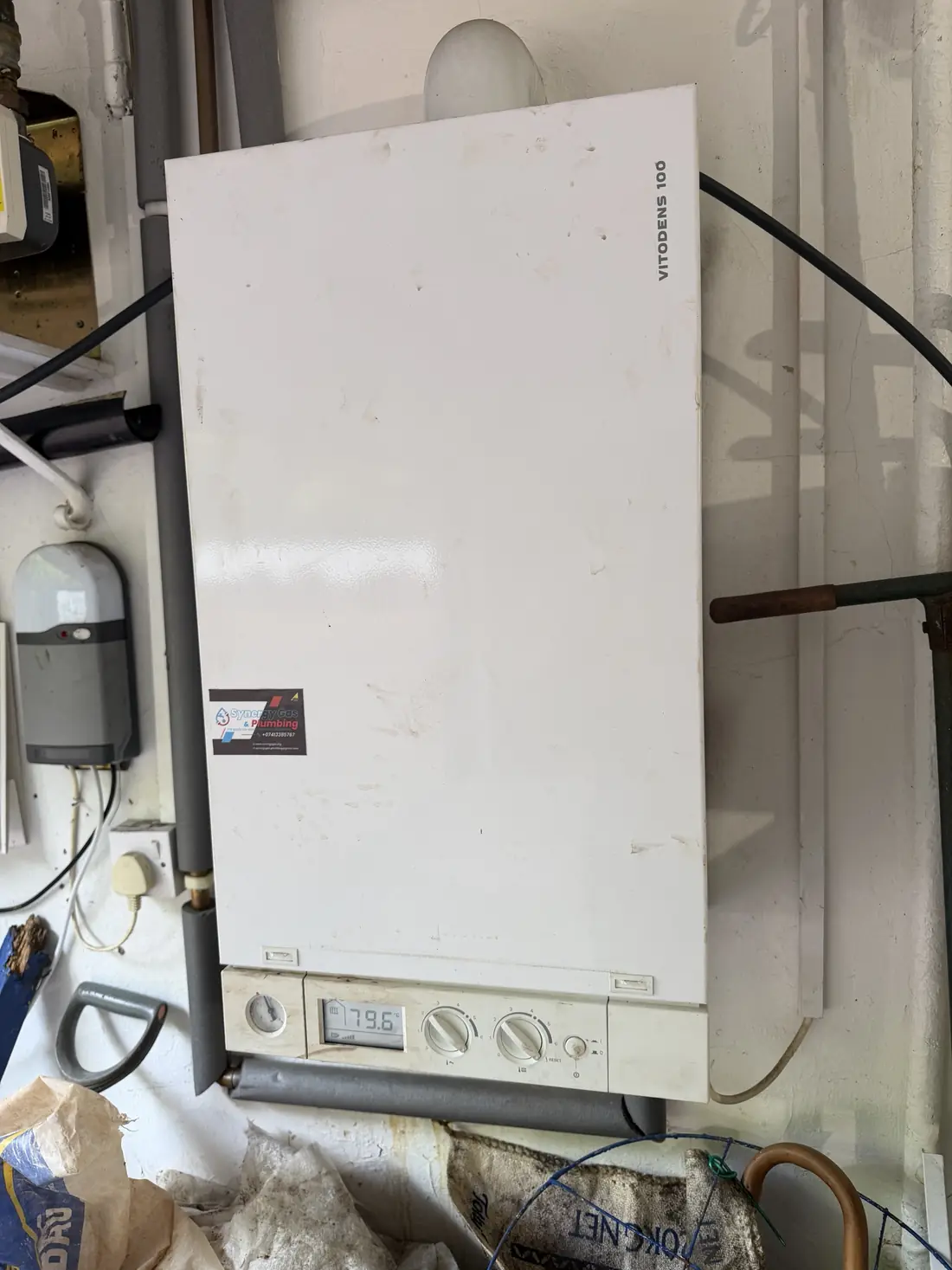 Viessmann Vitodens 100 system boiler on a garage wall in Edgbaston with a Synergy Gas and Plumbing sticker