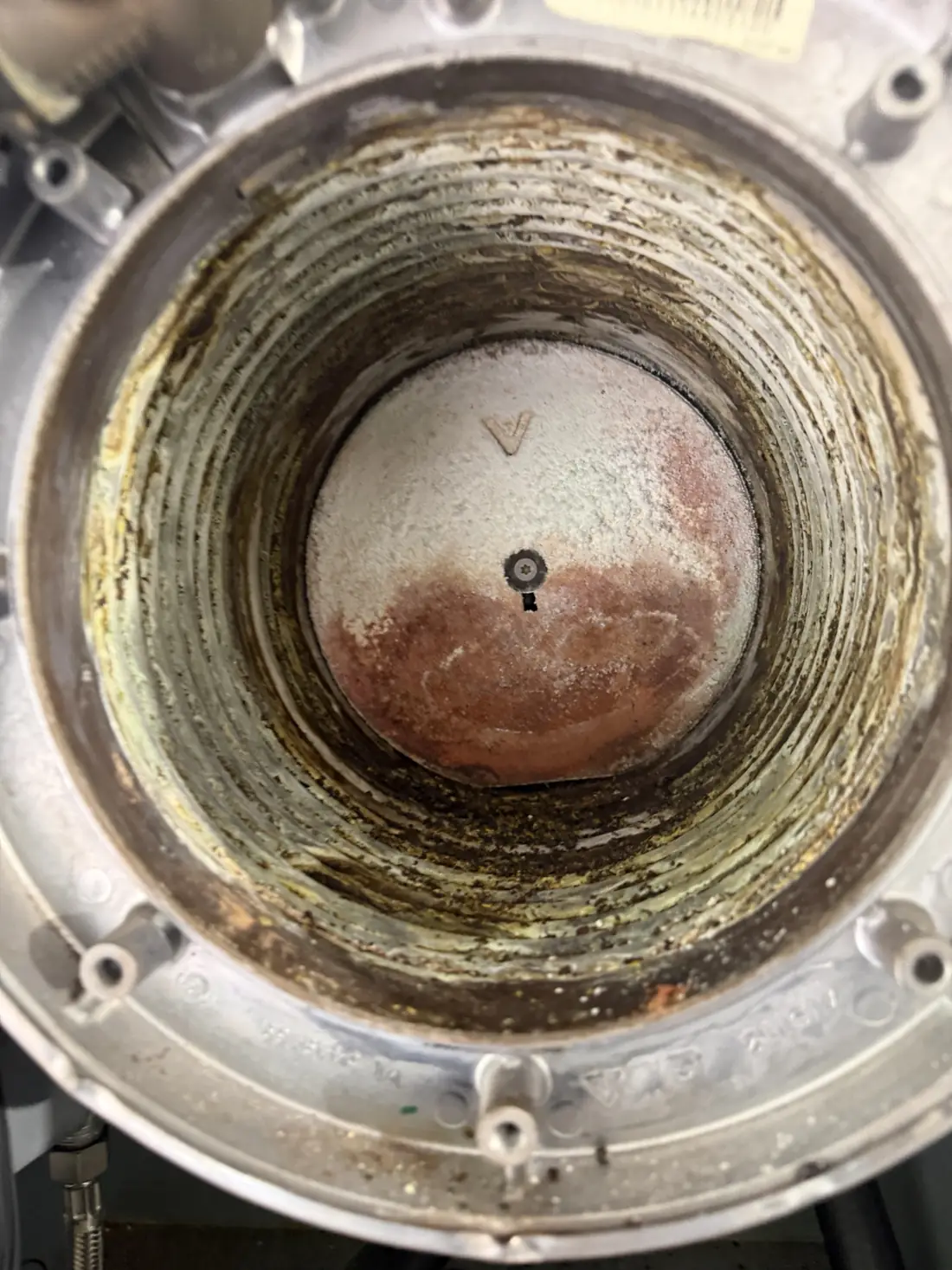 Inside the Viessmann Vitodens heat exchanger before cleaning, with deposits built up in the coils