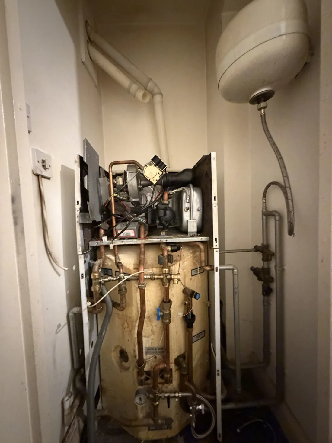 Potterton Powermax HE with its casing removed, showing the boiler above and the insulated hot water store below