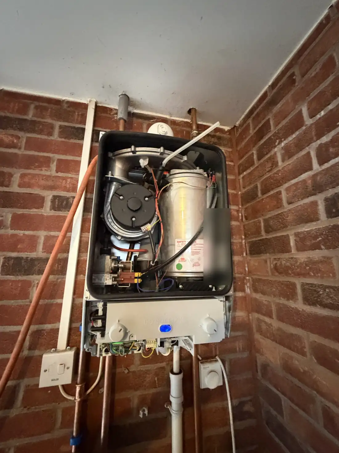 The new Worcester Greenstar boiler with the case off and the blue power light on