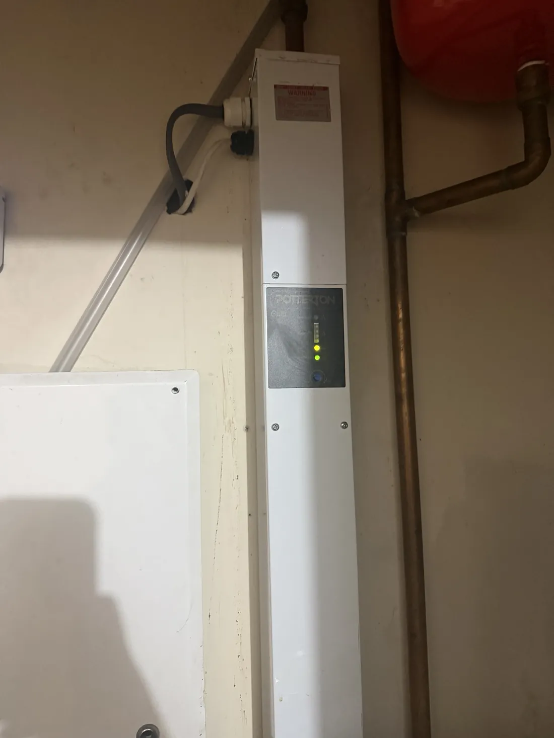 Potterton Gold electric boiler running again after an out-of-hours repair, with its status lights on