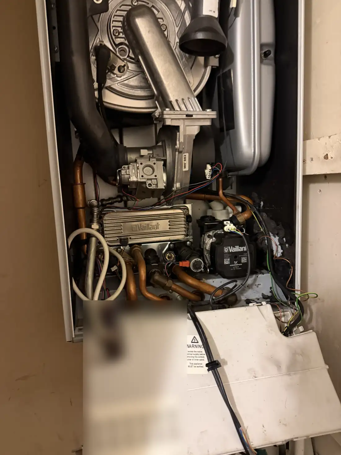 A Vaillant ecoTEC with a new black high-efficiency pump fitted at the bottom right