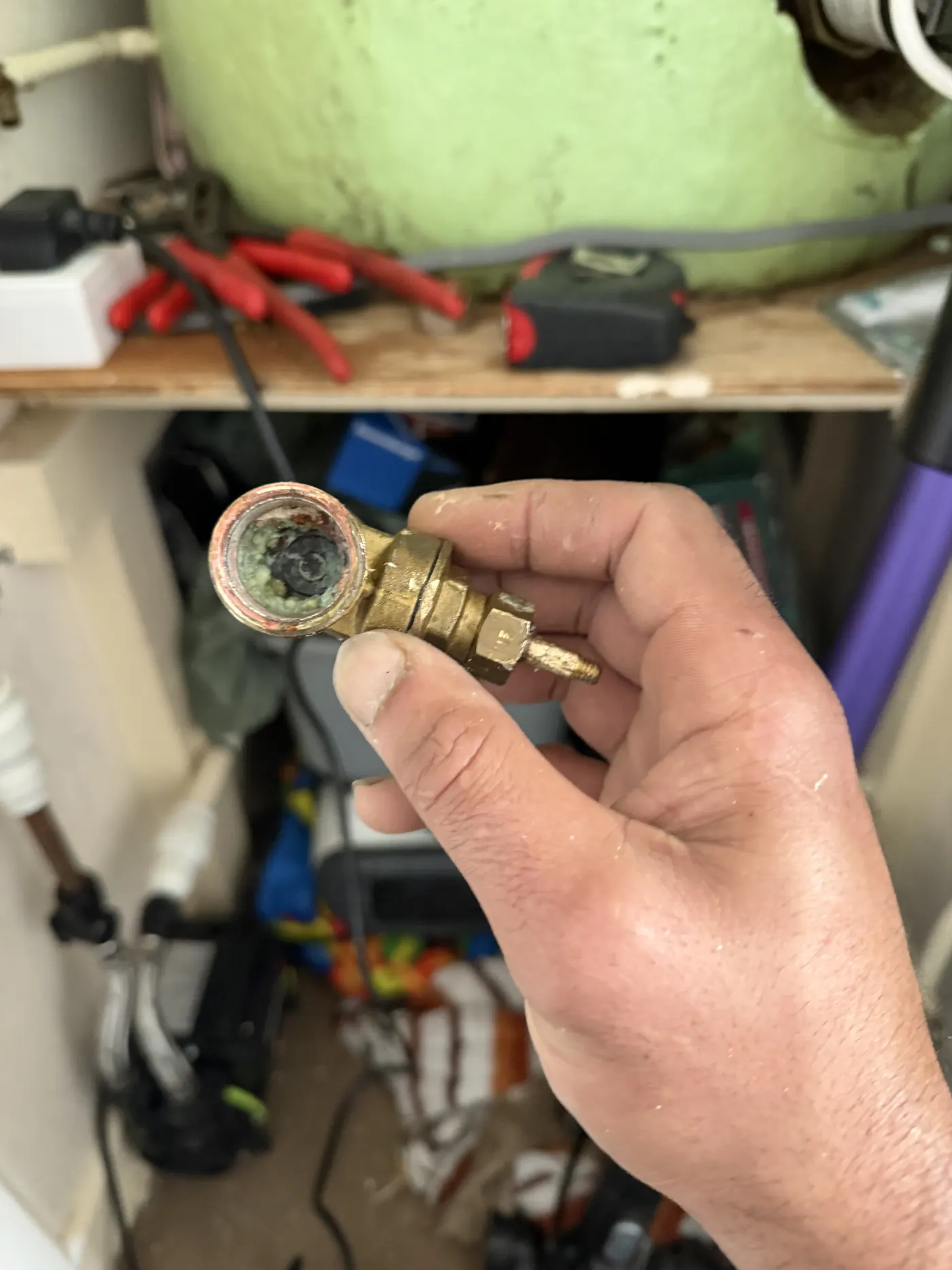 The inside of the snapped gate valve showing the corroded gate stuck partly closed in the bore
