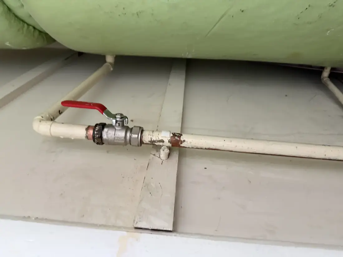 New full-bore lever valve fitted on the pipework beneath the hot water cylinder