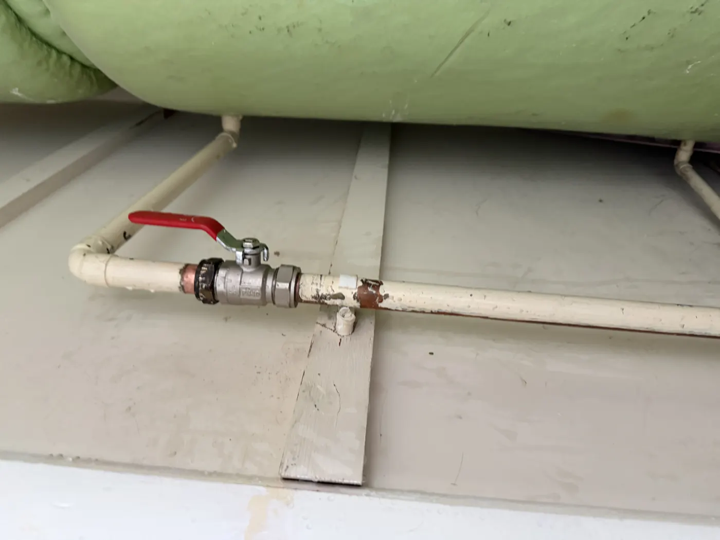 New full-bore lever valve fitted on the pipework beneath the hot water cylinder