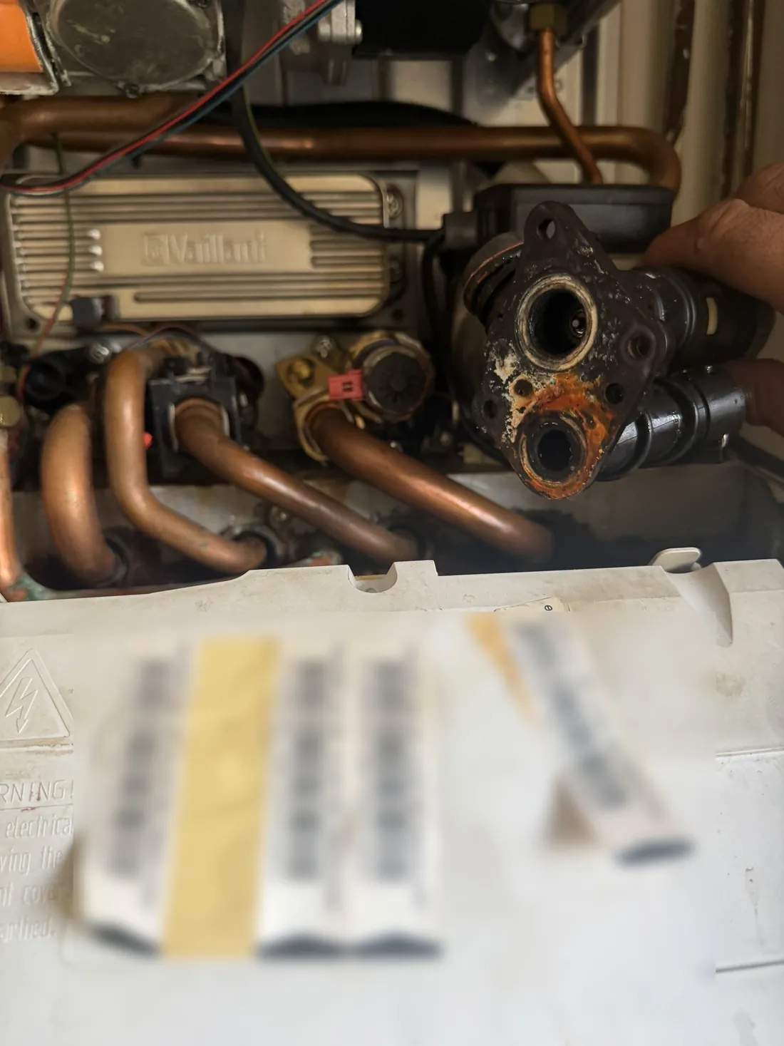 Old diverter valve removed from a Vaillant ecoTEC pro 28, with rust and corrosion around its ports
