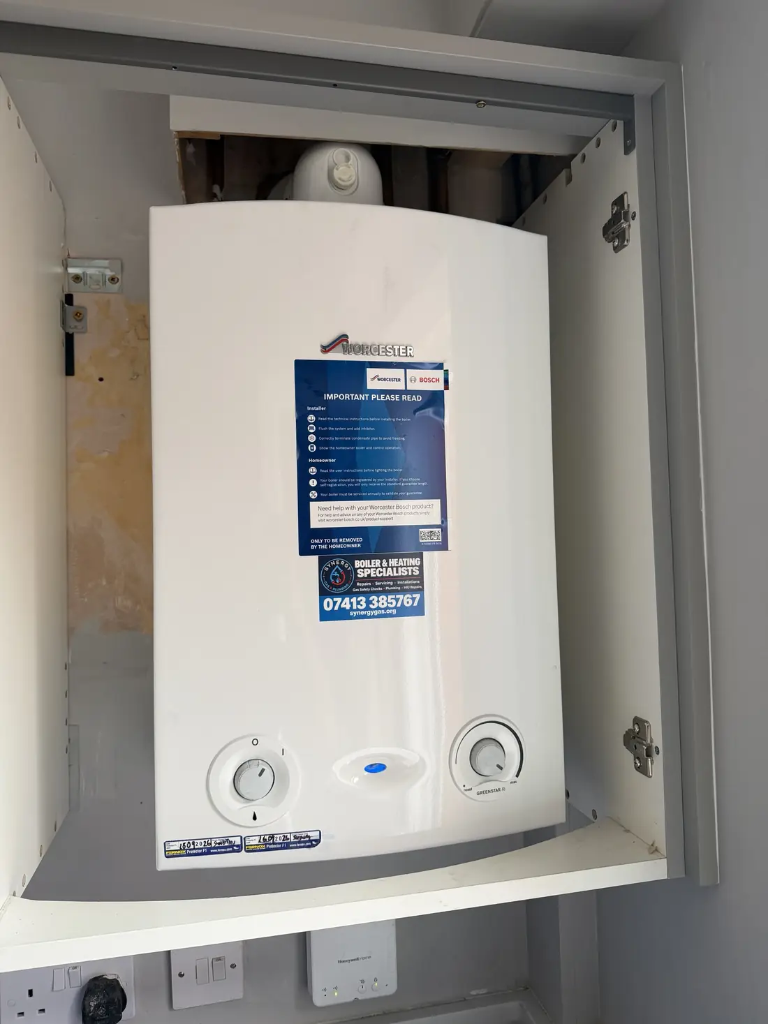 New Worcester Greenstar Ri ErP boiler installed in the same kitchen cupboard with Synergy Gas and Plumbing sticker