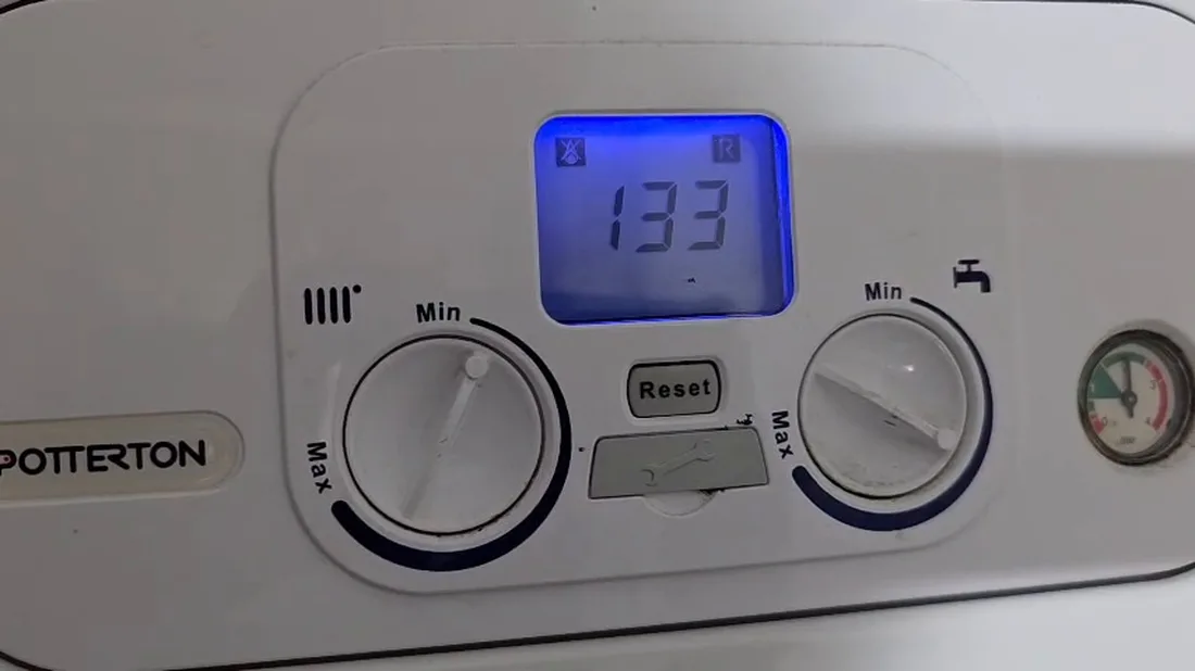 Potterton boiler control panel showing fault code 133, with the flame symbol and the reset symbol lit