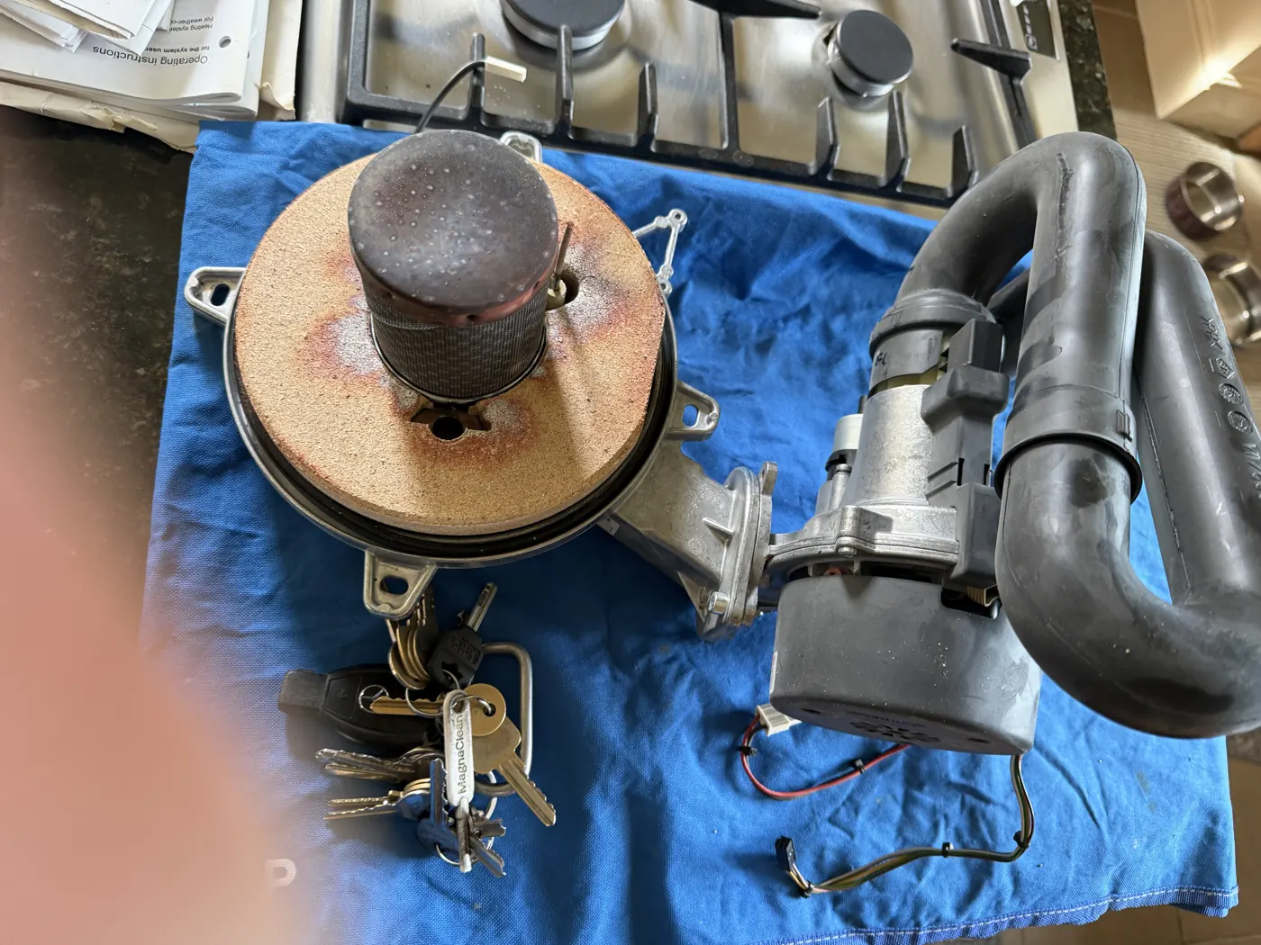 Viessmann fan and burner assembly removed from the boiler and laid on a dust sheet