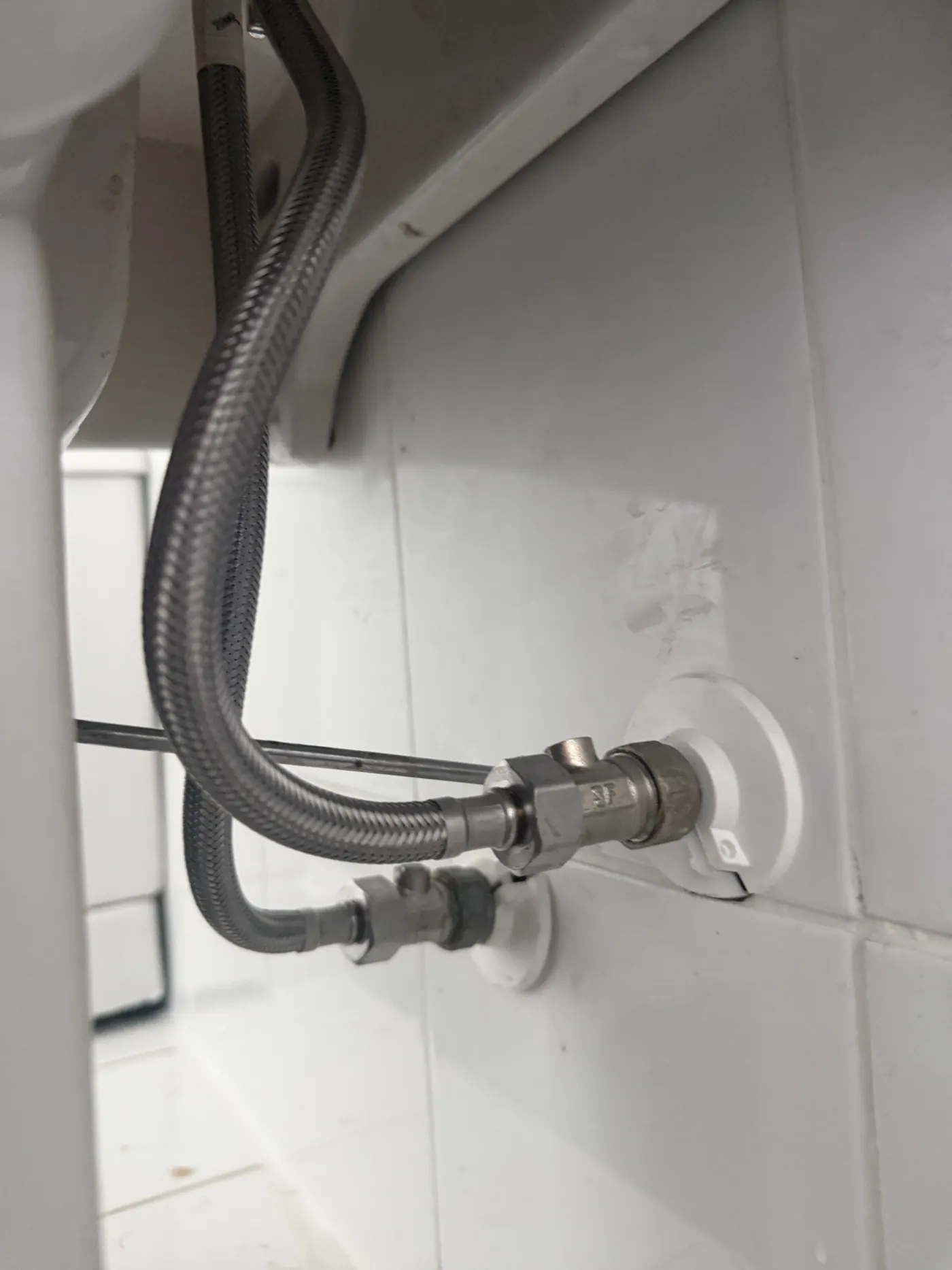 New braided tap connectors fitted to the isolation valves under the basin