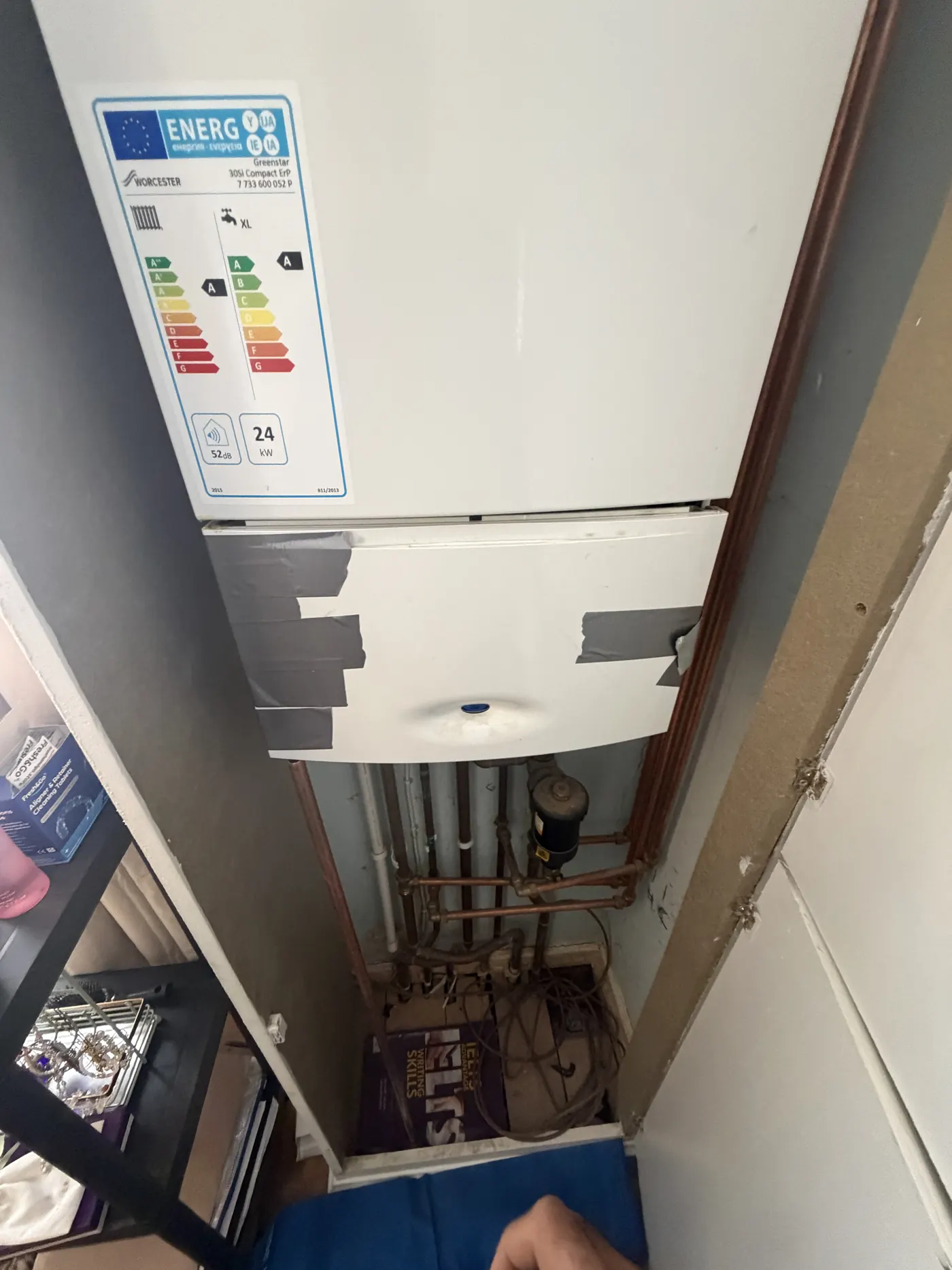 Worcester Greenstar Compact CDi boiler with its control panel held up by duct tape and a piece of copper pipe