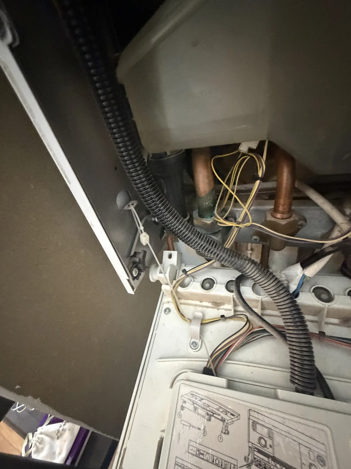 The broken hinge clip point on the Worcester Greenstar Compact CDi with the control panel dropped down