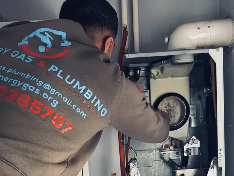 Our engineer refitting the fan and heat exchanger assembly on a Glow-worm boiler after a landlord gas safety inspection in Chelmsley Wood