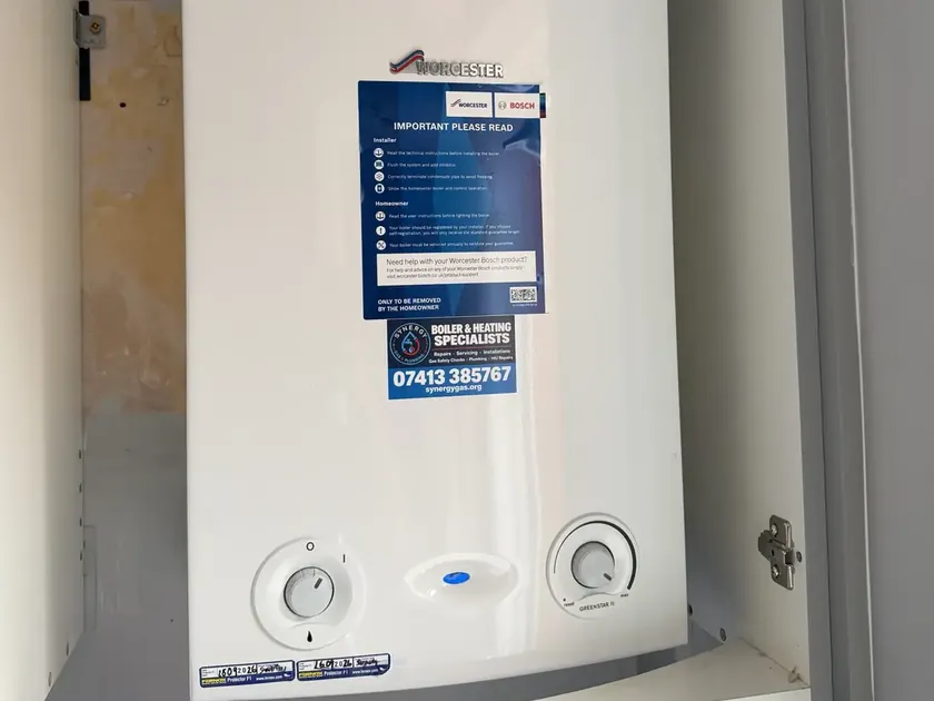 A new Worcester Greenstar Ri fitted in a kitchen cupboard in Solihull, with our sticker on the case